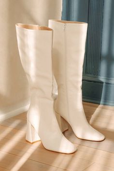 We have a feeling the Lulus Magnolia White Square Toe Knee-High Boots are going to complete all of your go-to looks this season! Smooth faux leather shapes these flirty boots that have a square toe upper and a 14.75"" knee-high shaft with a decorative seam-inspired detail at the outstep and a 15.5"" circumference. A 15.5 zipper at the instep makes for easy styling, while a trendy block heel completes the stylish look! 3. 75" wrapped block heel. Cushioned insole. Rubber sole has nonskid markings. White Boots Tall, White Boots Aesthetic, Knee High White Boots, White Knee High Boots Outfit, Daphne Halloween, Tall White Boots, White Go Go Boots, White High Boots, White Heeled Boots