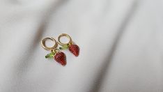 Strawberry earrings for any occassion. These are super cute and small for those that love the minimalist look. The strawberry charm is made out of alloy and measures 1cm. The earring from top to bottom measures 1.25 inches.  Each pair is handmade and sterlized before shipped. Trendy Tiny Sterling Silver Earrings, Cute Berry Colored Jewelry With Fruit Design, Trendy Tiny Adjustable Earrings, Cute Berry-colored Jewelry With Fruit Design, Cute Berry-colored Fruit Design Jewelry, Handmade Berry Colored Earrings For Gift, Handmade Berry Earrings For Gift, Handmade Trendy Sterling Silver Hoop Earrings, Trendy Handmade Sterling Silver Hoop Earrings