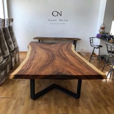 a wooden table sitting on top of a hard wood floor