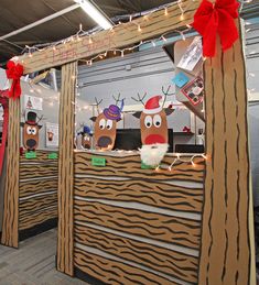 an office cubicle decorated for christmas with reindeer decorations