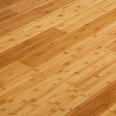 an overhead view of a wooden floor with no one on it or someone standing in the background