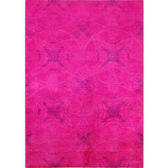 a bright pink rug with an intricate design on the front and back side, in shades of