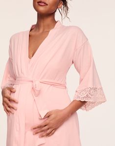 Elegant, lace trimmed kimono sleeves will make this your prettiest maternity and nursing robe. Pair it with the matching Rachelle Robe for an luxe set. Lace trimmed kimono sleeve Ample coverage to cover the bump Designed for pregnancy or after baby Knee length Soft rayon / spandex knit Nylon / spandex lace Feminine V-neck Robe For Sleep, V-neck Lace Trim Robe For Daywear, Spring Long Sleeve Nursing-friendly Sleepwear, Spring Nursing-friendly Long-sleeve Sleepwear, Spring Nursing Friendly Long Sleeve Sleepwear, Feminine Wedding Robe With Kimono Sleeves, Lace Trim V-neck Robe For Daywear, V-neck Robe With Lace Trim For Daywear, Feminine Fitted Robe For Loungewear