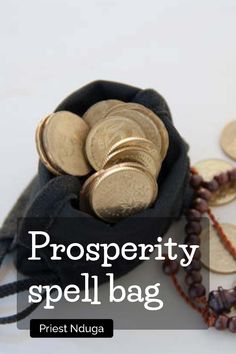 a bag filled with lots of gold coins next to some beads and necklaces on a white surface