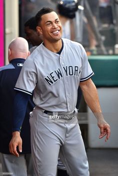 the new york yankees baseball player is walking on the field