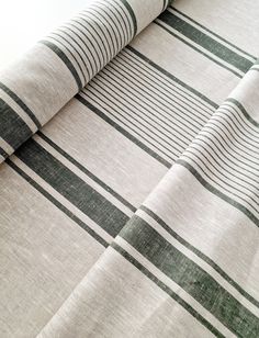 a close up view of a bed sheet with black and white stripes