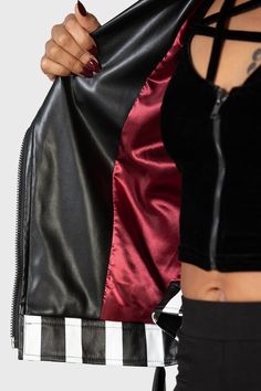 ZURIEL.- Soft, non-stretch textured PU fabric.- Statement stripe design.- Classic biker style.- Zip up closure.- Zip up pockets.- Belt.- Metal hardware.- Long sleeves.- Burgundy satin effect lining. - Fitted.- Wipe clean only.With KILLSTAR branding, Fabric 1: 64% Polyurethane, 36% Polyester. Fabric 2: 100% Polyester. Fabric 3: 60% Polyurethane, 40% Polyester.Machine wash cold (30°c) / Do not bleach / Do not tumble dry / Iron at low temperature / Do not dry clean. Imported. Hooded Biker Jacket With Zipper Closure, Fitted Hooded Biker Jacket With Zipper, Fitted Hooded Biker Jacket With Zipper Closure, Winter Sporty Biker Jacket For Biker Events, Sporty Biker Jacket For Winter Events, Black Winter Outerwear With Side Zipper, Black Outerwear With Side Zipper For Winter, Black Leather Jacket With Zipper For Motorcycling, Black Leather Jacket With Zipper Closure For Motorcycling