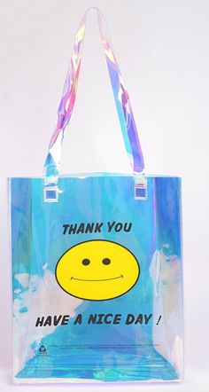 a blue bag with a yellow smiley face on it that says thank you have a nice day