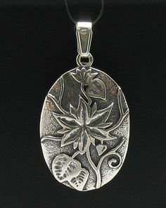 Sterling silver pendant - PE000423. APPROXIMATE WEIGHT 4.7 GRAMSDIMENSIONS 3.0X2.2CM(1.2x0.88inches) All our jewels are made from solid sterling silver 925/1000 and are carefully crafted by hand in our family workshop.We dispatch your orders in 5 working days, worldwide and the postage is $5. We ship registered priority mail. Please allow 5-7 working days for delivery in Europe and 10-15 working days outside Europe.For any questions – please do not hesitate to contact me! Nature-inspired Engraved Silver Jewelry, Sterling Silver Flower Pendant In Antique Silver, Antique Silver Sterling Flower Pendant Jewelry, Collectible Silver Flower Jewelry, Silver Flower Pendant Jewelry Stamped 925, Collectible Silver Nature-inspired Jewelry, Collectible Nature-inspired Silver Jewelry, Sterling Silver Flower Pendant Locket, Silver Flower Pendant Locket Jewelry