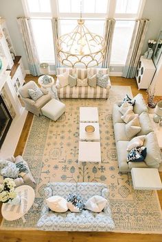 an aerial view of a living room with couches, chairs, and coffee table