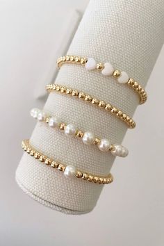 one pearl stacking bracelet with 14k gold beads bracelets are made on a durable stretch elastic cord please refer to our sizing guide before purchasing Pearl Bracelet With Words, Beaded Bracelet For Girls, Stretch Pearl Bracelets, Good Beaded Bracelets, Pearl Stack Bracelets, Pearl And Gold Bracelet Stack, Beaded Bracelets Pearls, Gold Bead Bracelet Ideas, Pearl And Bead Bracelet