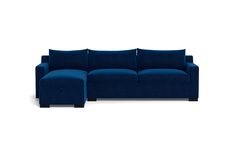 a blue sectional couch with pillows on the top and bottom, in front of a white background