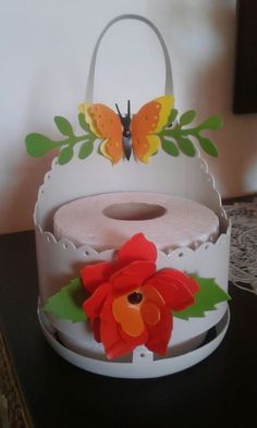 a white cake with red flowers and butterflies on it