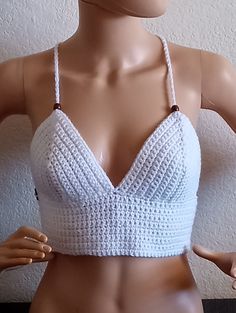 Keep cool this summer🌞 with this beautiful, fun crop top!   I know you will enjoy this one. You are sure to get compliments.   Great for the beach, a night out, festival or just running errands.  Also comes in Variety of colors and made to order! Made with premium acrylic yarn from Turkey. Not itchy or scratchy....will hold up forever forever! **Hand wash **lay flat to dry, do not wring out to prevent strechting Bohemian V-neck Crop Top For Beach Season, Trendy V-neck Crop Top For Beach, Summer Festival V-neck Halter Top, Trendy V-neck Crop Top For Vacation, Bohemian V-neck Halter Top For Summer, Beachwear Cropped Crop Top For Beach Season, Fitted Triangle Top Crop Top Bra Friendly, Summer V-neck Beach Crop Top, Summer Party Triangle Top