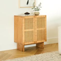 a wooden cabinet sitting on top of a hard wood floor