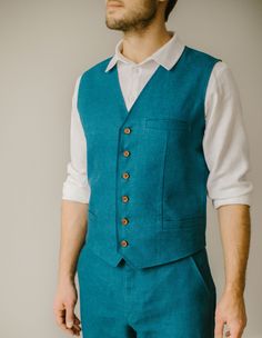 "Our rustic wedding waistcoat stands as an example of our commitment to quality. Each one is handmade, with an exclusive focus on tailoring to the unique measurements of our customers. We firmly prioritize craftsmanship over mass production, ensuring that every creative and sewing task is duly recognized and rewarded. DESCRIPTION. Our rustic wedding waistcoat has buttons in the front, three pockets, and a double layer in the front. This vest blends modern and timeless styles, so it's a great add Fitted Vest With Buttons For Wedding, Fitted Wedding Vest With Buttons, Sleeveless Vest With Buttons For Wedding, Tailored Sleeveless Suit For Wedding, Tailored Sleeveless Three-piece Suit For Wedding, Tailored Sleeveless Wedding Suits, Fitted Sleeveless Nehru Jacket For Wedding, Fitted Wedding Vest, Classic Fitted Nehru Jacket For Groom