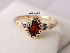 Welcome to my shop, you can find many beautiful gemstone jewelry here, and you also can ask for customized service.  Main Stone: natural garnet, oval cut, measures 6X8 mm, weight 1.74 carats. Accent Stones: Lab alexandrite and cz Metal: 14k solid yellow gold/white/rose gold/sterling silver Setting: half bezel setting  more rings: https://www.etsy.com/shop/XCjewelryStudio?ref=hdr_shop_menu It's quite comfortable for wearing and suitable for all occasions (wedding, anniversary, Christmas) styles a White Stone Finger Ring Gold, Silver Garnet Engagement Ring, Vintage Garnet Rings, Gold Rings Engagement, Garnet Ring Gold, Gem Stone Ring, Christmas Styles, Meaningful Rings, Garnet Wedding Rings