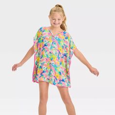 Fit & Style Floral Cover-Up Top Lightweight Fabric Opaque Sheerness V-Neckline Turnback Hem Below-Hip Length Your Kiddo Will Kick Back In Style Whether Playing At The Beach Or Relaxing Poolside With This Floral Cover-Up Top From Cat & Jack. This Sleeveless Cover-Up Top Features Floral Print With Pom-Pom Detailing On The Edges And A Turnback Hem For A Beautiful Look They'll Love To Show Off. The Lightweight Fabric Helps Keep Them Comfortable, While The Opaque Lining Provides Extra Protection Agai Playing At The Beach, Cat Top, Kids Swimming, Cat & Jack, Fit Style, Floral Printed, Hip Length, Lightweight Fabric, At The Beach