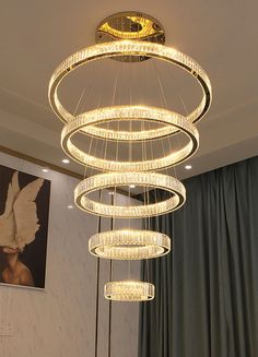 a modern chandelier hanging from the ceiling