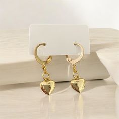 Elevate your style with these exquisite hypoallergenic gold plated handmade heart hoop earrings. Meticulously crafted for those with sensitive skin, these earrings offer a perfect blend of elegance and comfort. The heart-shaped design adds a touch of romance and sophistication to any outfit, making them a versatile accessory for both casual and formal occasions. ●14.5mm 24k gold plated lever back hoop earring ●10mm 18k gold plated heart charm 💎Hypoallergenic Material: Ideal for sensitive ears, Minimalist Dangle Hoop Earrings For Valentine's Day, Minimalist Gold Heart Earrings With Charm, Minimalist Gold Heart Drop Earrings, Heart-shaped Minimalist Hoop Earrings, Tarnish Resistant, Minimalist Heart-shaped Tarnish Resistant Hoop Earrings, Minimalist Heart-shaped Tarnish-resistant Hoop Earrings, Small Hoop Tarnish Resistant Earrings For Valentine's Day, Gold Metal Earrings With Heart Charm, Minimalist Gold Heart Pendant Earrings