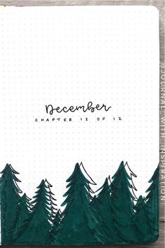 a notebook with trees and the words december written on it