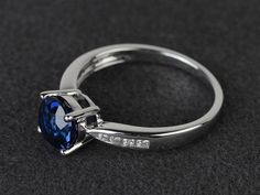 Welcome to my shop, you can find many beautiful gemstone jewelry here, and you also can ask for customized service. Main Stone: lab created sapphire, round cut, measures 7X7mm, weight about 1.64 carats.Accent Stones: czMetal: 925 sterling silver plated with rhodium. I also can provide metal options such as 14k solid yellow/white/rose goldSetting: prong settingmore rings: https://www.etsy.com/shop/XCjewelryStudio?ref=hdr_shop_menuIt's a perfect gift for the person who was born in September (Birth Sapphire Topaz Round Ring For Promise, Sapphire Topaz Promise Ring, Sapphire Topaz Ring For Promise, Sapphire Birthstone Ring With Round Stone, Sterling Silver Sapphire Ring With Round Cut, Formal Round Sapphire Birthstone Ring, Formal Sapphire Birthstone Ring, Sapphire Solitaire Birthstone Ring, Round Sapphire Solitaire Birthstone Ring