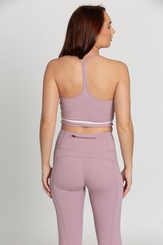 Our Mauve Mist White Line Crop Tank is the perfect addition to your athleisure collection. Featuring a white line detail, sleek Y-Back design, and sweat wicking material, this tank effortlessly takes you from your workout class to brunch with the girls. Pilates Princess, Tennis Skirts, White Line, Athletic Top, Yoga Tops, Size 00, Crop Tank, Model Height, Bra Tops