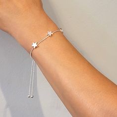 "This beautiful silver, gold stars bracelet has an adjustable chain as adjusts to fit different wrist sizes. Great gift for yourself, friends, and family. Perfect for any occasion gifts. - Handmade item - Brass - Bracelet Size: 6.25\" - 8.5\" - Bracelet Heart: 0.25\" (7x7mm) - Closure: Adjustable Slide clasp, Pull Tie - Style: Minimalist" Adjustable Star Shaped Metal Bracelets, Adjustable Metal Star Bracelet, Adjustable Star-shaped Minimalist Bracelet, Dainty Star-shaped Adjustable Bracelet, Adjustable Gold Star Bracelet, Stars Bracelet, Bolo Bracelet, Bracelet Heart, Clasp Bracelet