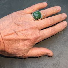 Masculine elegance. I took a timeless design and made it bigger, fuller and heavier. I personally make each ring to order using 100% genuine, natural British Columbia Nephrite Jade. I buy this stone in rough form at the Tucson Gem Show in February of each year and cut it and polish it myself. This ring weighs over 30 grams. I do a comfort fit finish on the inside which makes it feel smooth and comfortable on the finger. Stone: Finest quality natural, undyed, British Columbia Nephrite Jade. Avail Modern Green Signet Ring With Polished Finish, Timeless Green Signet Ring With Polished Finish, Formal Green Handmade Signet Ring, Green Handmade Signet Ring For Formal Occasions, Handmade Green Signet Ring For Formal Occasions, Classic Handmade Emerald Ring, Modern Green Ring With Large Stone, Elegant Handmade Green Signet Ring, Tucson Gem Show