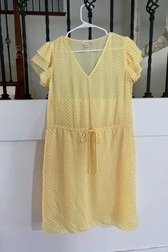 Spring Yellow Shift with Black Dots! Flattering dress with short sleeves, above the knee length, and tie in the middle. Simple v-neck top. A versatile dress for any occasion! Summer Short Sleeve V-neck Dress With Tie Waist, Summer V-neck Dress With Tie Waist And Short Sleeves, Casual Short Sleeve V-neck Dress For Daywear, Casual Short Sleeve V-neck Dress, Polka Dot Short Sleeve Dress For Vacation, Casual Polka Dot Short Sleeve Dress, Casual Polka Dot V-neck Dress, Casual V-neck Dress With Tie Waist And Short Sleeves, Casual V-neck Polka Dot Dress