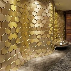 a room that has some gold tiles on the wall