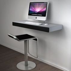 an apple computer sitting on top of a desk