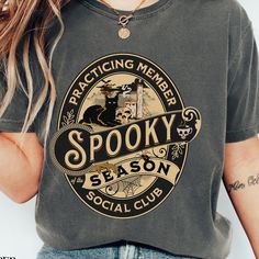 Celebrate the magic of Halloween with our Spooky Season Social Club T-Shirt! Made from soft Comfort Colors fabric, this oversized crew shirt offers both style and comfort, perfect for all your spooky festivities. Featuring a vintage retro design, it's ideal for Halloween parties, casual outings, or cozy nights in. Whether you're gathering with friends or enjoying a haunted movie night, this shirt is a must-have for any Halloween lover. Embrace the season and show off your spooky spirit in style! Retro Halloween T-shirt With Character Print, Vintage Halloween T-shirt With Letter Print, Vintage Halloween Tops With Character Print, Vintage Halloween Character Print Top, Vintage Halloween T-shirt With Character Print, Vintage Halloween Cotton T-shirt, Vintage Halloween Graphic Print Tops, Vintage Cotton Halloween T-shirt, Vintage Cotton Tops For Halloween