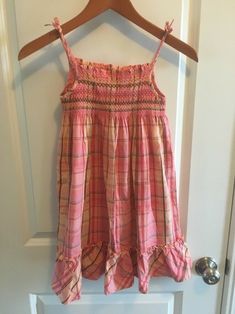 This Carter's dress is a size 6x. It is smocked at the top and flowy at the bottom. Smoke free home. It is a beautiful coral plaid color. Summer Plaid Dress With Smocked Bodice, Fitted Plaid Smocked Dress, Plaid Cotton Smocked Dress With Smocked Bodice, Cotton Plaid Dress With Smocked Back, Plaid Cotton Smocked Dress, Coral Outfits, Smocking Dress, Coral Outfit, Dream Aesthetic