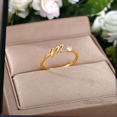 Give a personalized 🎁 gift that will captivate the hearts of your loved ones with this adjustable ring with a beautifully crafted initial in a gold plated finish. It is the perfect choice for people looking for an elegant, refined and original piece of jewelry for an everyday look. 🌟 Material: Copper Alloy Gold plated finish. ☑️ Aesthetic design ☑️ Adjustable size: adjustable to all fingers by gently opening it This ring is the ideal original 🎁 gift for a loved one or simply for yourself. Thi Minimalist Jewelry With Initials For Anniversary, Gift Heart Ring With Cubic Zirconia And Open Design, Adjustable Cubic Zirconia Rings For Valentine's Day, Gold Diamond Ring For Valentine's Day Proposal, Gold Plated Heart Ring For Gift, Dainty Jewelry For Valentine's Day Proposal, Valentine's Day Gold Diamond Ring For Proposal, Gold Diamond Ring For Proposal On Valentine's Day, Elegant Gold Crystal Ring For Valentine's Day