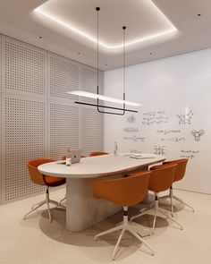 a conference table with orange chairs and a white board on the wall in an office