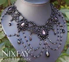 "Introducing our exquisite Handmade Victorian-Inspired Necklace - a captivating blend of gothic allure and vintage charm. Meticulously crafted by hand, this statement piece showcases a captivating design woven from delicate rondelles, shimmering preciosa Czech beads, and dazzling rhinestones. The centerpiece of this necklace is a magnificent pear-shaped stone, commanding attention with its exquisite beauty. Flanked by two smaller stones on each side, it creates a harmonious balance that is both striking and elegant. Designed with versatility in mind, this necklace is perfect for a range of occasions, whether it's a romantic candlelit dinner, a night out with friends, or a special event. Its Victorian-inspired aesthetic adds a touch of timeless sophistication, while the modern twist ensures Beading Techniques Free Pattern, Goth Wedding Jewelry, Fantasy Jewelry Necklace, Victorian Jewelry Necklace, Intricate Necklace, Victorian Gothic Wedding, Victorian Gothic Jewelry, Gothic Choker Necklace, Necklace Fancy