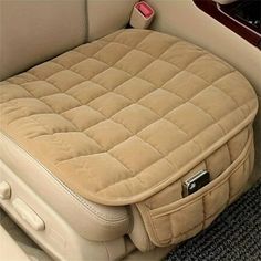 the inside of a car with a seat cushion on it