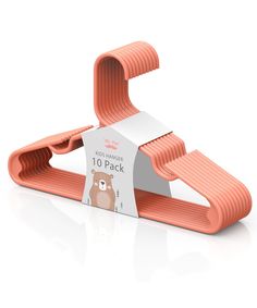 an orange paper holder with a bear on it's side and a white tag hanging from the top