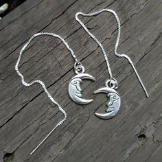 Comfortable, eye catching, & matches everything you own -- what more can you ask for in earrings?  Shop sterling silver man in the moon ear threaders at The Snarky Owl Workshop, only on #Etsy.  Small-batch jewelry handcrafted in metal, glass, gemstones, and shell. Ear Threader, Man In The Moon, Crescent Moon Earrings, In The Moon, Celestial Jewelry, Threader Earrings, Moon Earrings, Chain Earrings, Small Batch