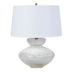 a white table lamp with a white shade on it