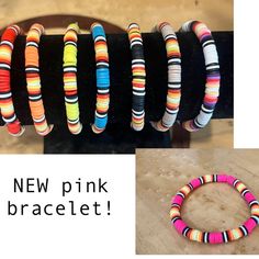 the bracelets are all different colors and have black, white, yellow, pink, blue, orange