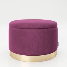 a purple ottoman with gold trim around it