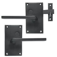 two black door handles and latches on a white background