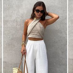 Chic Halter Neck Top With Crisscross Straps, Sleeveless Bandage Tops For Beach, Chic Sleeveless Bandage Crop Top, Beach Sleeveless Bandage Top, Chic Bandage Tank Top For Summer, Summer Beach Bandage Top, Chic Wrap Top For Vacation In Spring, Chic Sleeveless Summer Wrap Top, Chic Spring Vacation Wrap Top