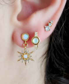 18K Gold Opal Star Earrings, Opal Stud Gold Earrings, CZ Starburst Stud Charm Earrings, Dainty Earrings, Celestial Earrings, Birthday Gift ♥♥This listing is for one pair of gold STUD opal star charm earrings ♥♥ ♥ DESCRIPTION:      Elegant and delicate gold opal stud earrings, this pair, comes with dangling cubic zirconia and opal star charms, creating the perfect setting of a dazzling starry night.    Perfect for everyday wear or for a special occasion.     ♥ MATERIAL & SIZE:    18K gold plated Stud Gold Earrings, Celestial Earrings, Opal Earrings Stud, Opal Studs, Earrings Dainty, Opal Earrings, Dainty Earrings, Jewelry Cleaner, Star Charms