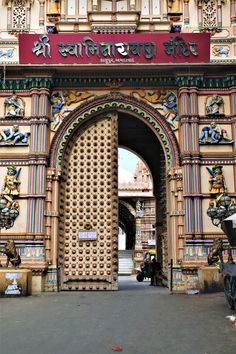 the entrance to an old building with ornate carvings