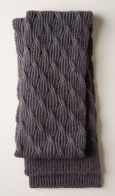 two gray knitted scarves on top of each other