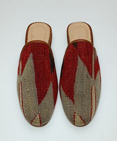 Welcome to AliDesignStore This Kilim Mules one -of-A-kind! Upper Made of a Hand-Selected Vintage Turkish Kilim Rug .  Kilims Rugs Are Hand Crafted From Vegetable Yarn. Have Stronger weave. - Handcrafted - Materials : Handwoven Kilim Rug                       Leather Sole                        Leather Trimmed                       Leather Lining                       Stacked Leather Sole                       Rubber Under The Stacked Heel  Care:   Soft Clothing Brush İs Recommended To Clean The Traditional Slip-on Clogs With Rubber Sole, Handmade Bohemian Closed Toe Moccasins, Bohemian Handmade Slip-on Slippers, Bohemian Handmade Slip-on Mules, Bohemian Closed Toe Moccasins For Festival, Handmade Bohemian Closed Toe Slippers, Handmade Bohemian Closed Toe Mules, Handmade Bohemian Slip-on Mules, Traditional Slippers With Rubber Sole And Round Toe