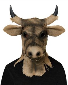 a man wearing a cow mask with long horns